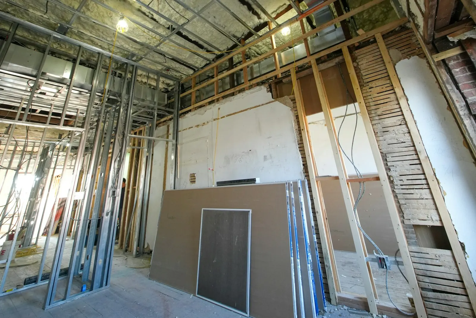 Walls opened to the studs so the framing can dry after a leak